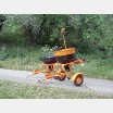 Fertilizer spreader for chemical treatment of vegetation